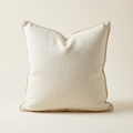 Ivory linen pillow with a softly chopped top